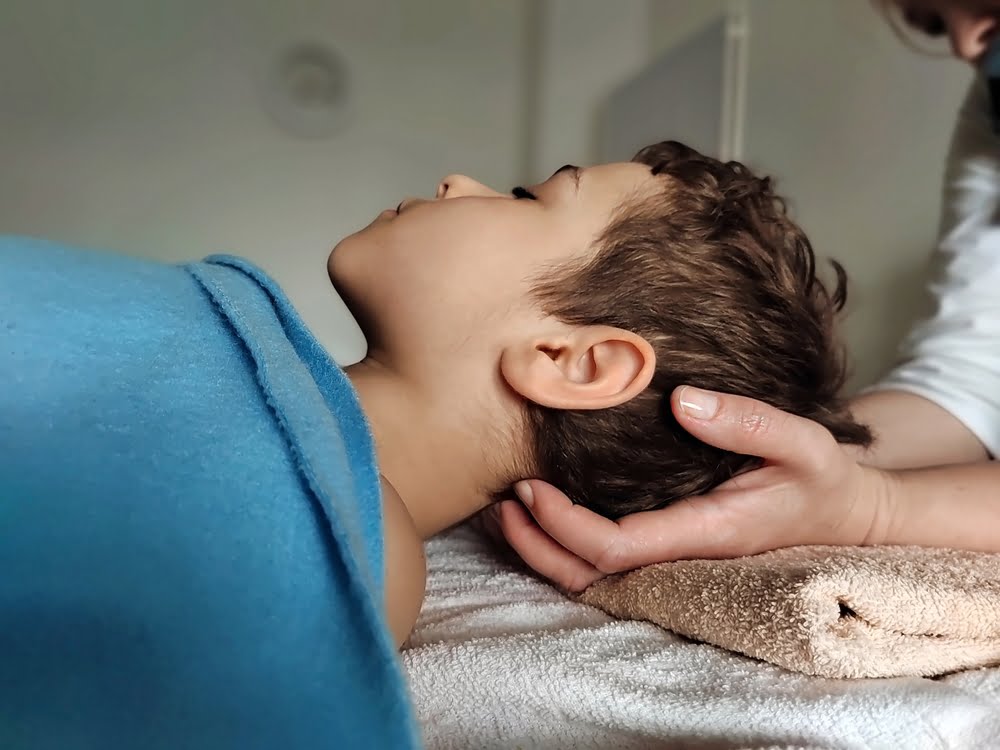 Child having a neck adjustment - Pediatric Chiropractor in Brunswick, GA Child having a neck adjustment - Pediatric Chiropractor in Brunswick, GA